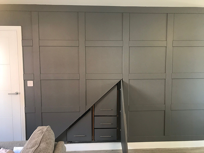 hidden storage under stairs cupboard